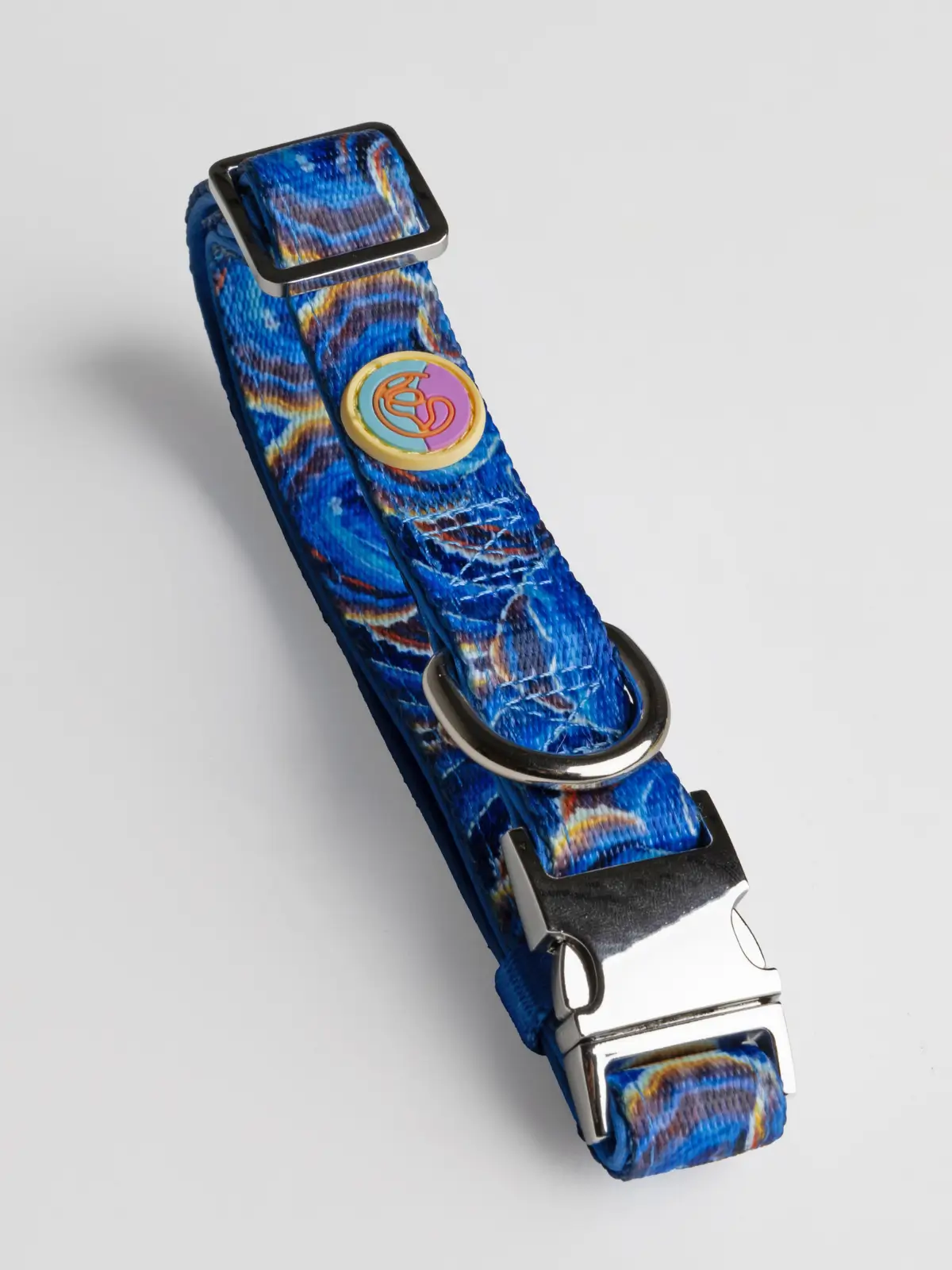 luxury-le-chouchou-dog-collar Close-up of Aqua Mystique collar showing blue pattern and Le ChouChou Paris logo