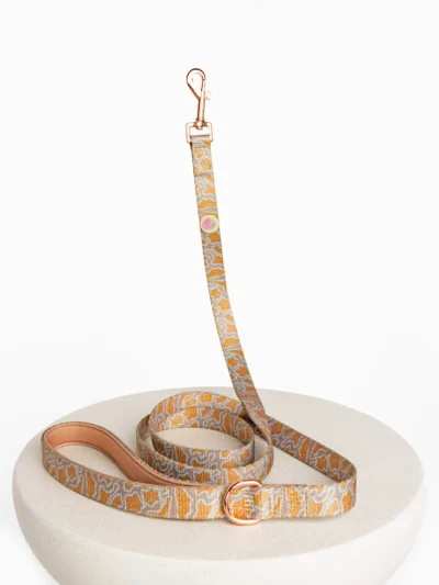 luxury-le-chouchou-dog-leash Leafy Glacé designer dog leash displayed on a table with rose gold hardware – Le ChouChou Paris